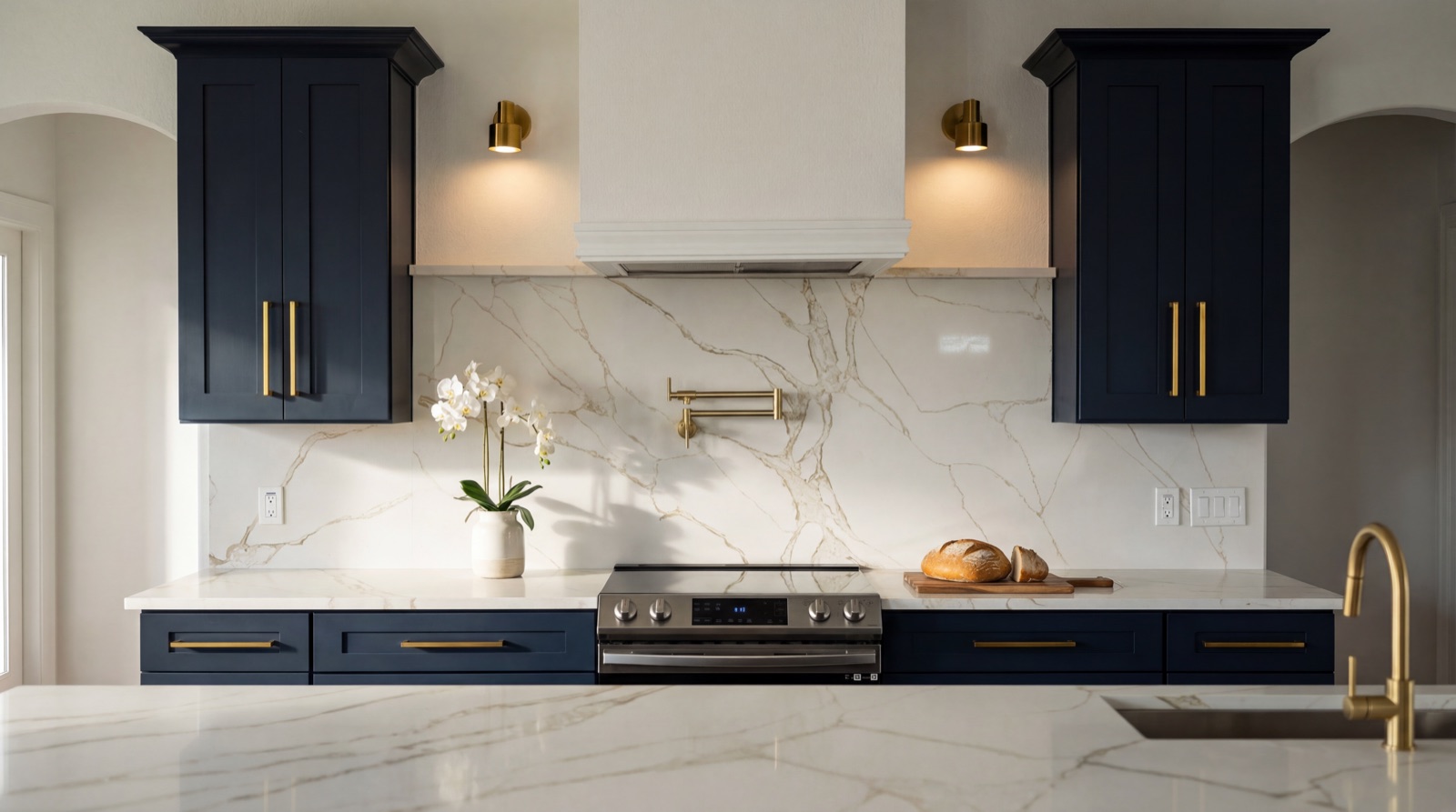 Navy shaker kitchen with Calacatta countertops by Tapserwood Cabinets