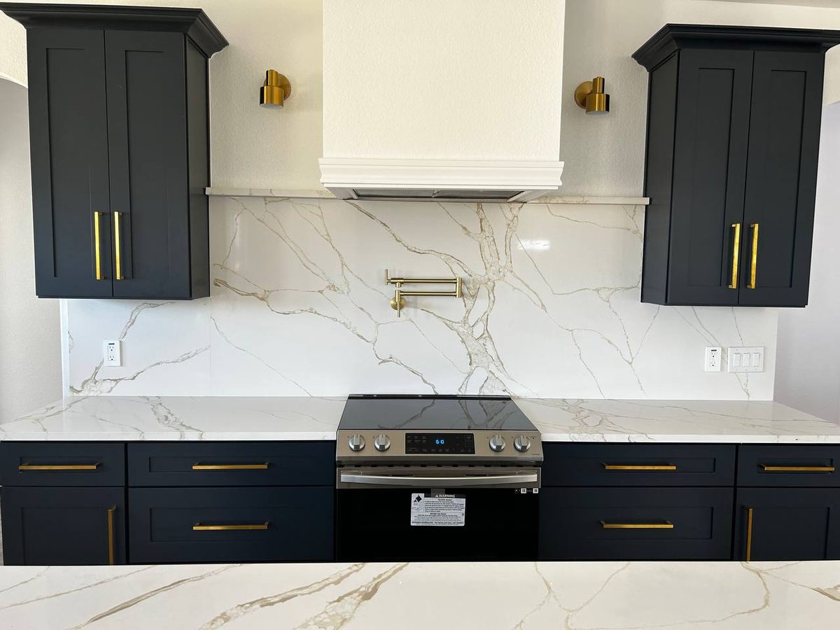 Range wall with Calacatta slab backsplash