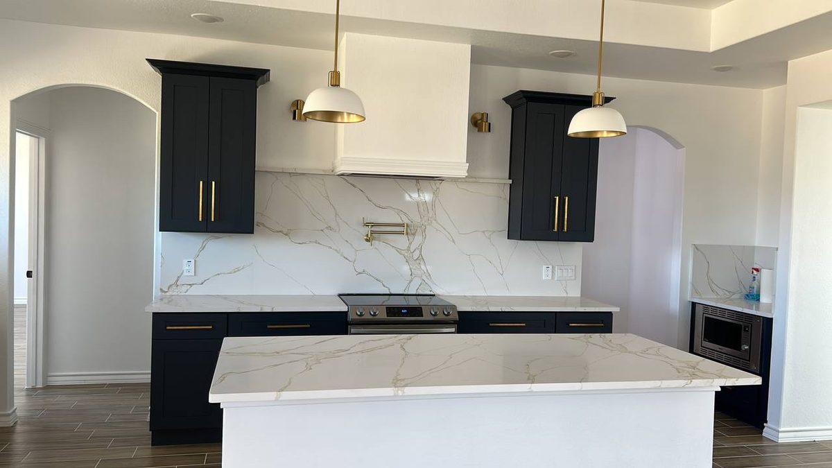 Open view of navy kitchen with island